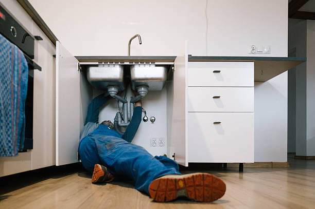 Professional Drain Cleaning technician working in Harristown, IL